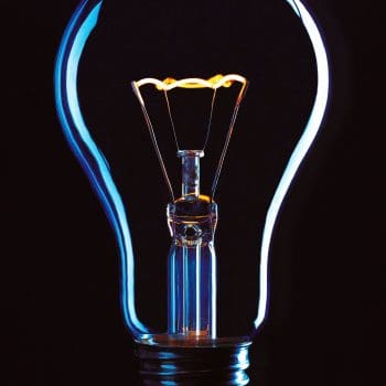 A lightbulb against a black background